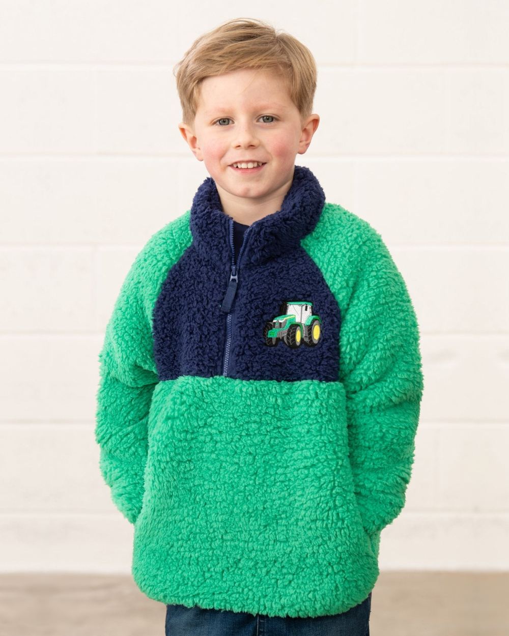 Green Tractor coloured Lighthouse Childrens Caden Fleece on wall background 