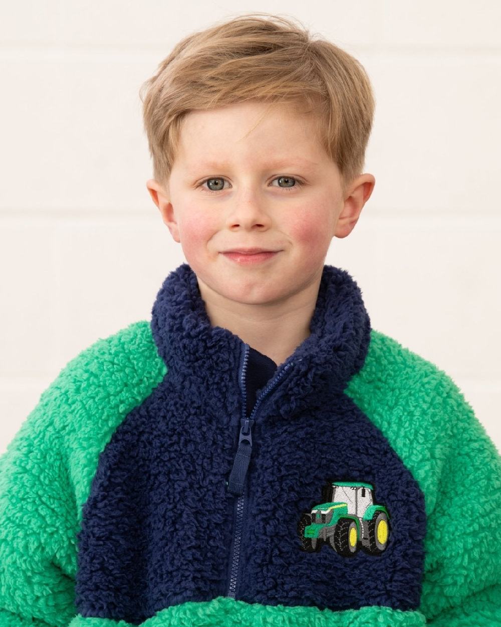 Green Tractor coloured Lighthouse Childrens Caden Fleece on wall background 