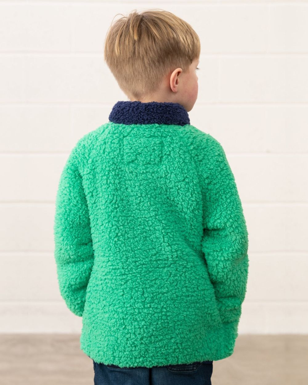 Green Tractor coloured Lighthouse Childrens Caden Fleece on wall background 