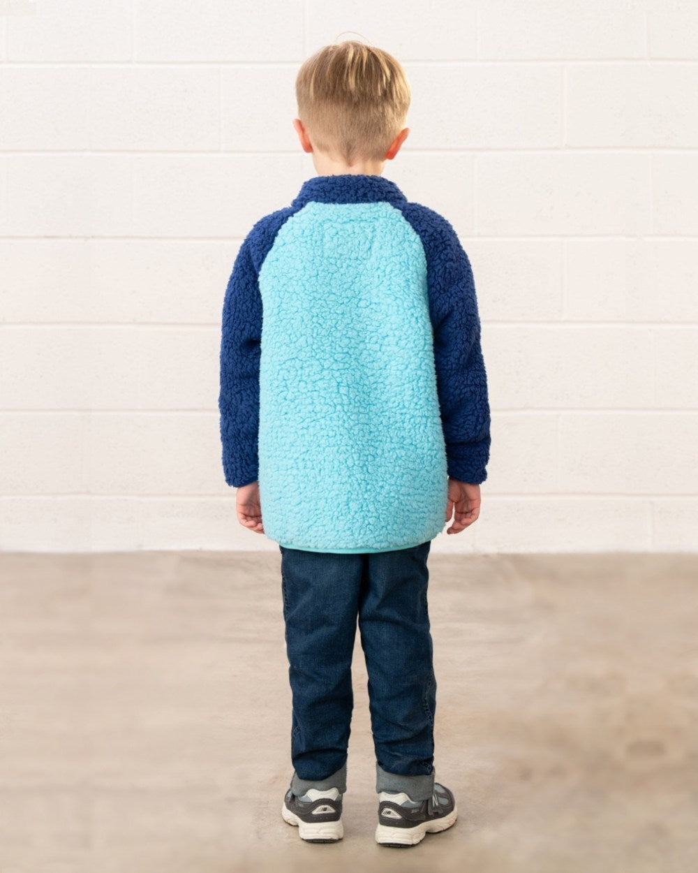 Navy Blue Orange coloured Lighthouse Childrens Caden Fleece on wall background 