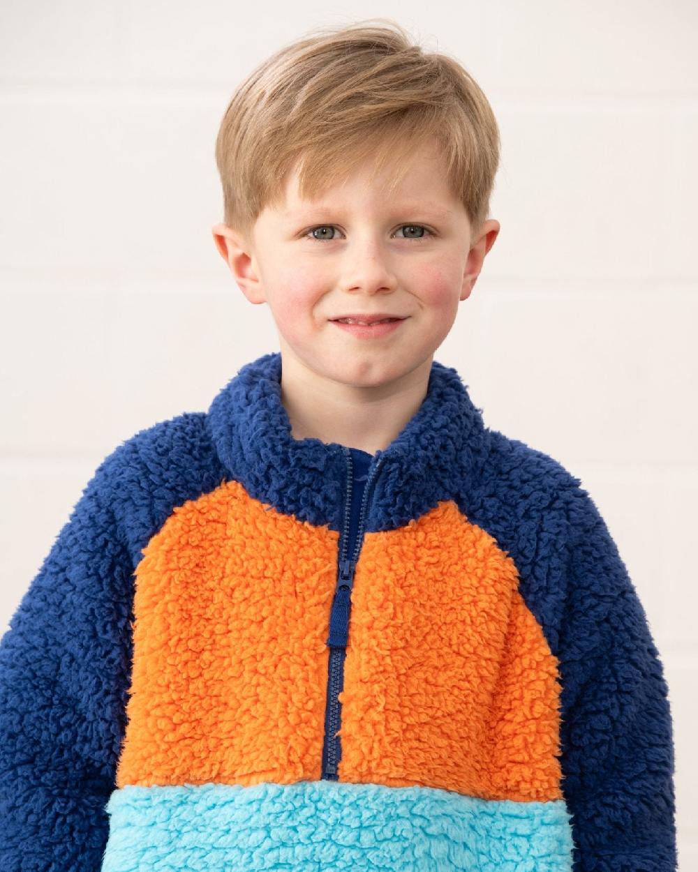 Navy Blue Orange coloured Lighthouse Childrens Caden Fleece on wall background 