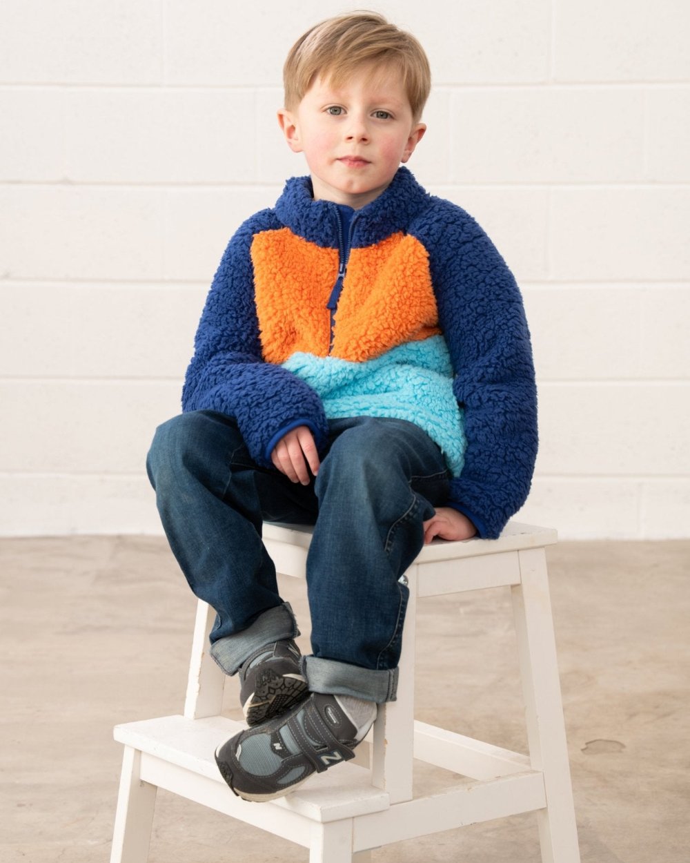Navy Blue Orange coloured Lighthouse Childrens Caden Fleece on wall background 