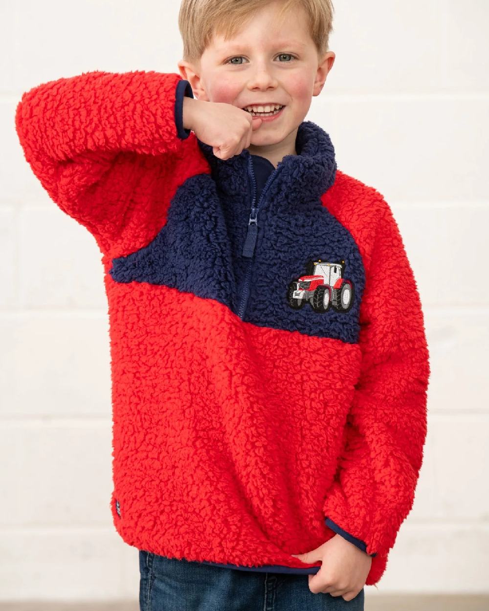 Red Tractor coloured Lighthouse Childrens Caden Fleece on wall background 