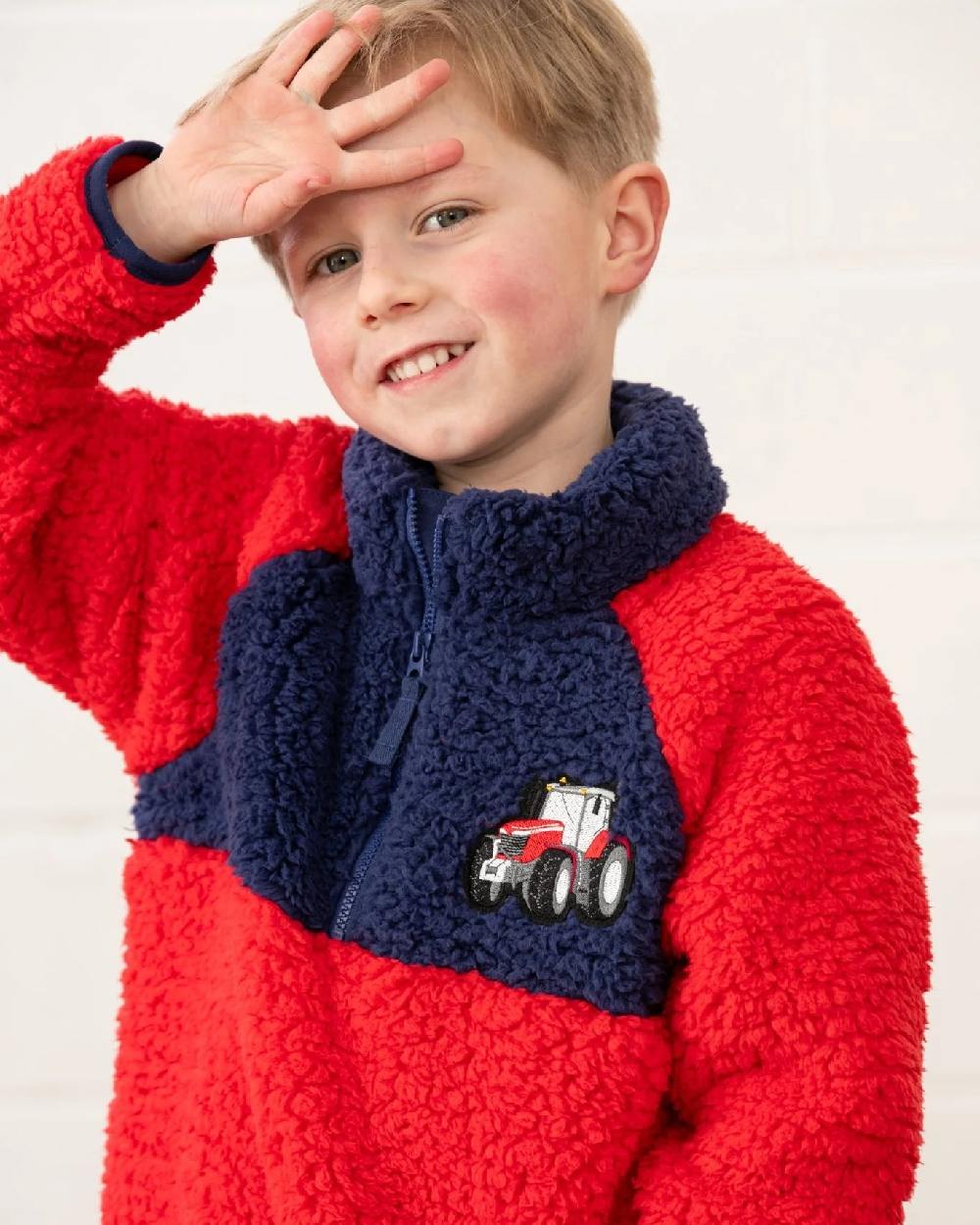 Red Tractor coloured Lighthouse Childrens Caden Fleece on wall background 