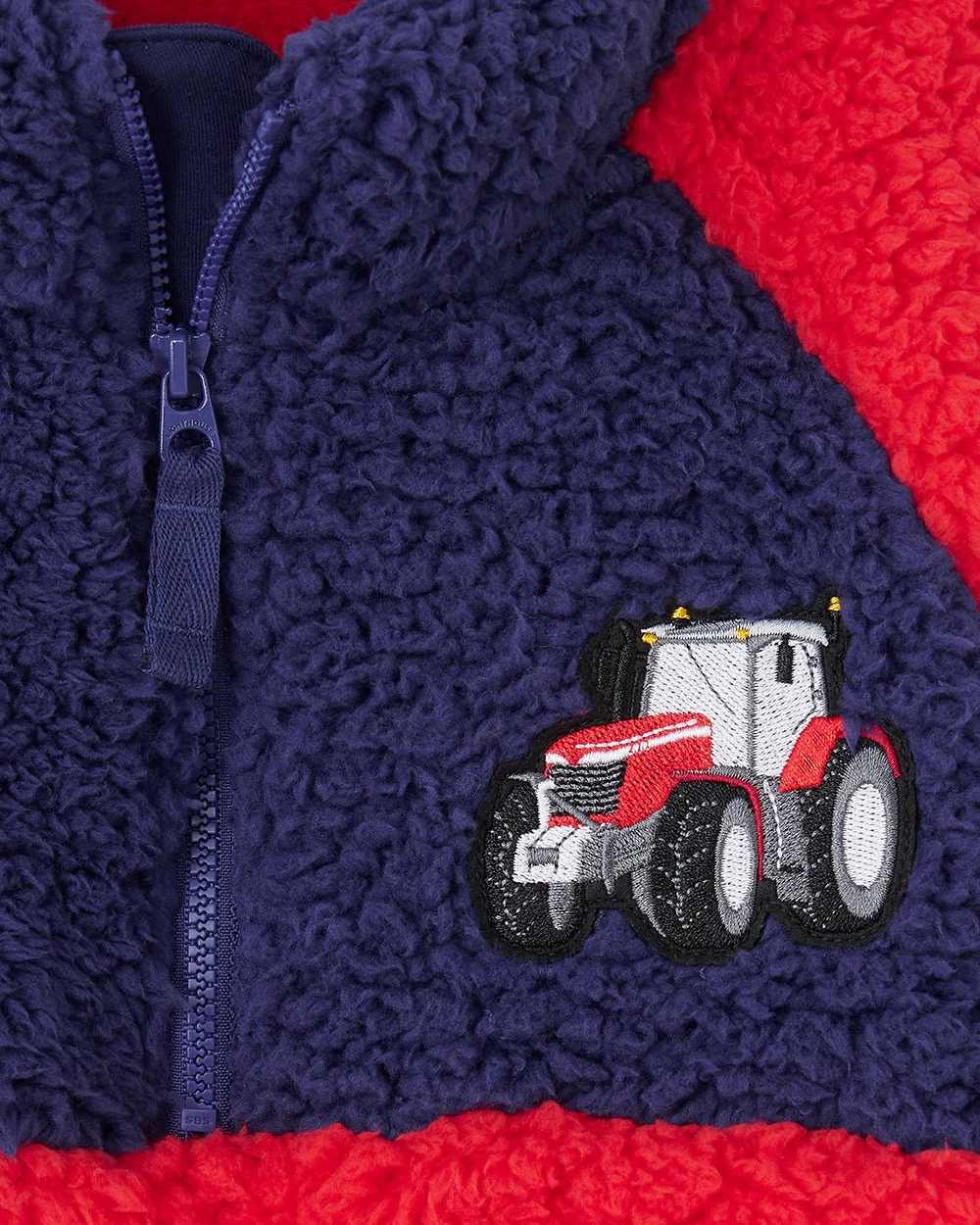 Red Tractor coloured Lighthouse Childrens Caden Fleece on wall background 