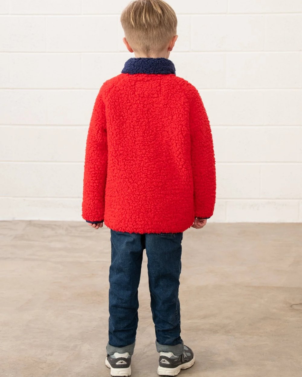 Red Tractor coloured Lighthouse Childrens Caden Fleece on wall background 