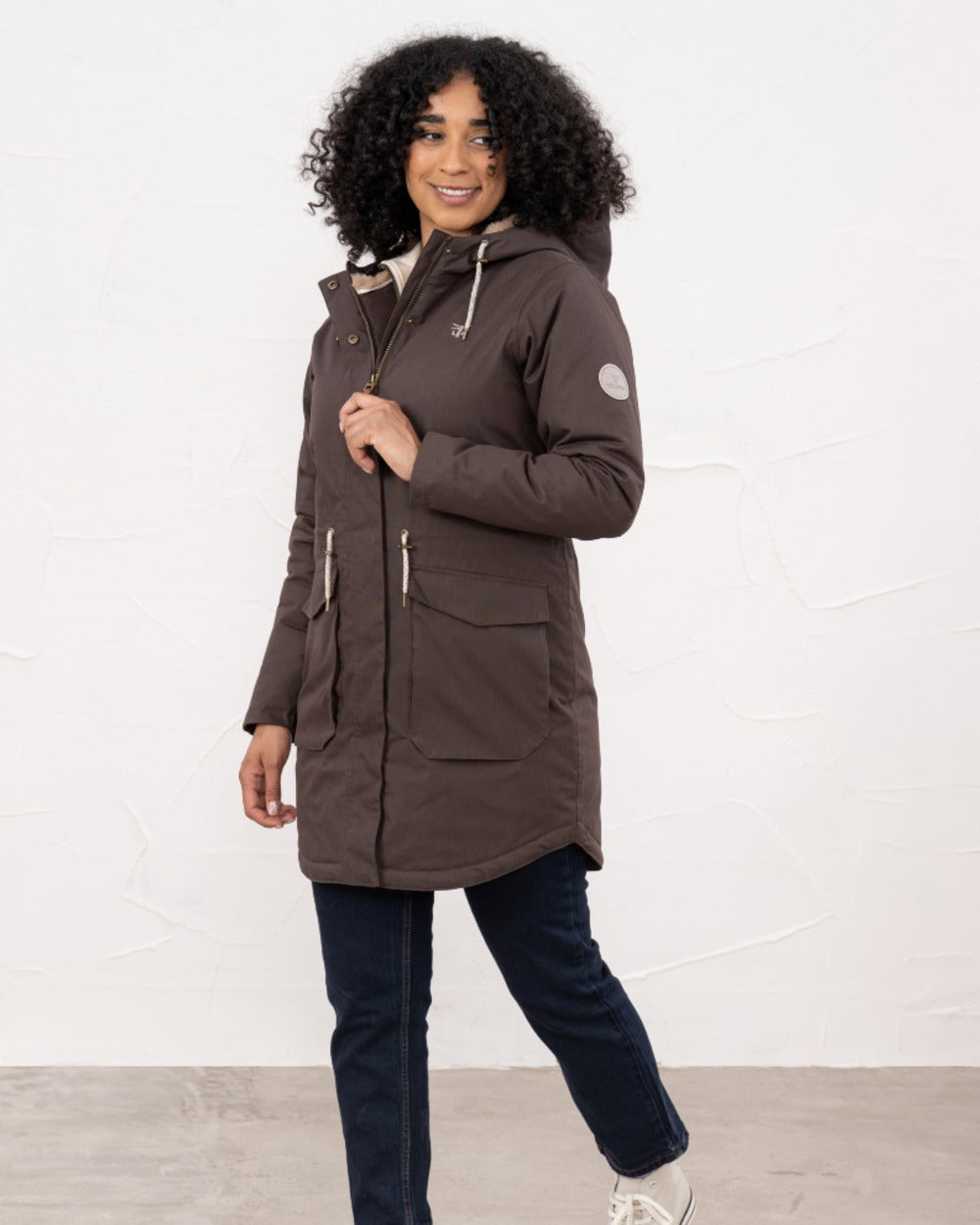 Cocoa coloured Lighthouse Isobel Ladies Coat on wall background 