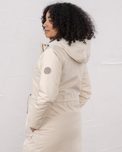 Irish Cream coloured Lighthouse Isobel Ladies Coat on wall background 