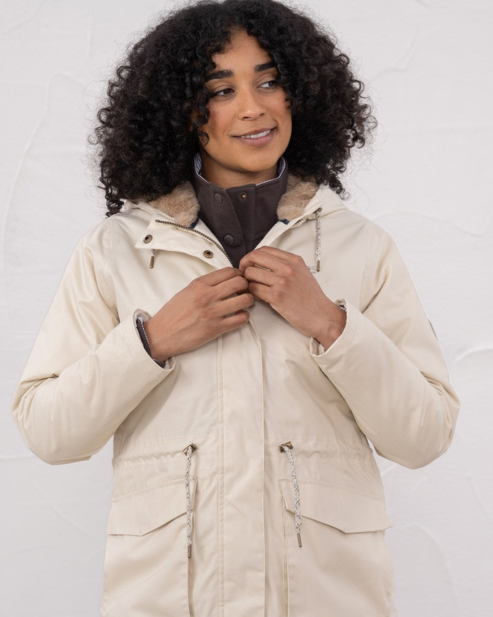 Irish Cream coloured Lighthouse Isobel Ladies Coat on wall background 