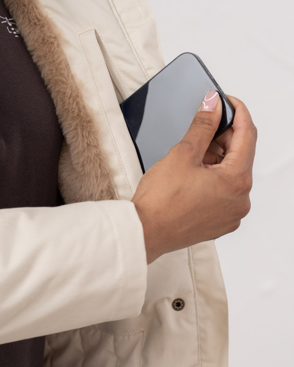 Irish Cream coloured Lighthouse Isobel Ladies Coat on wall background 