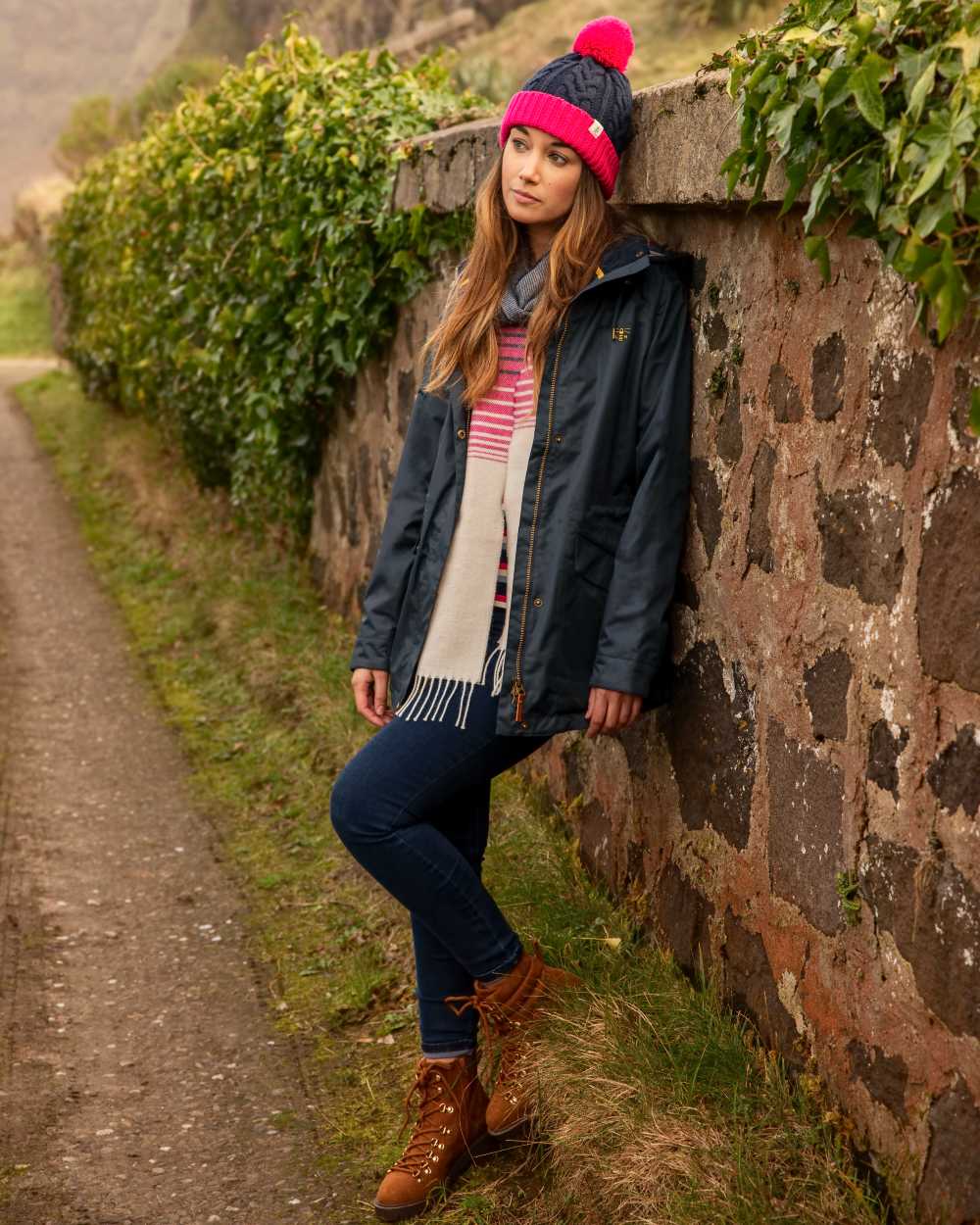 Nightshade coloured Lighthouse Kendal Waterproof Coat on street background 