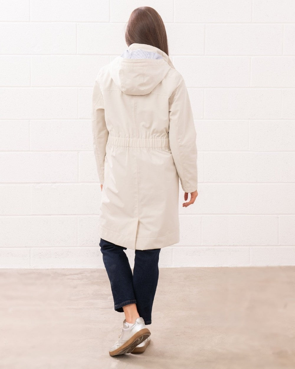Cream coloured Lighthouse Ladies Annika Coat on wall background 