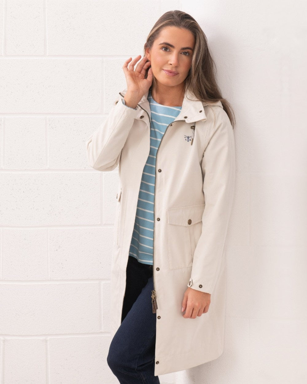 Cream coloured Lighthouse Ladies Annika Coat on wall background 