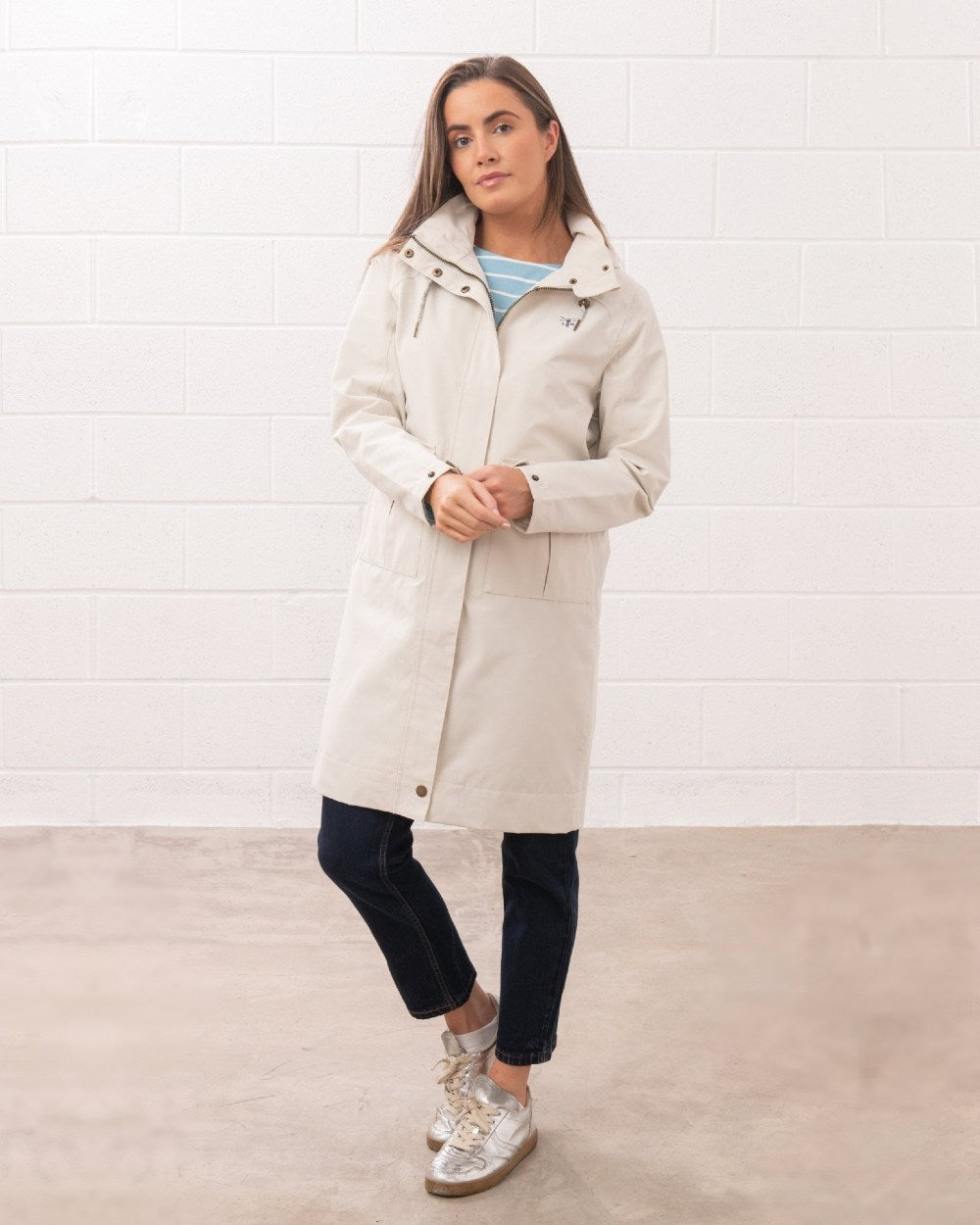 Cream coloured Lighthouse Ladies Annika Coat on wall background 