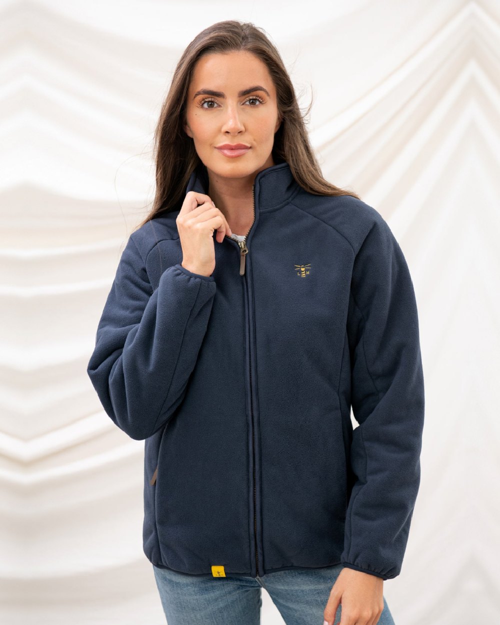 Navy coloured Lighthouse Ladies Avon Waterproof Fleece on curtain background 