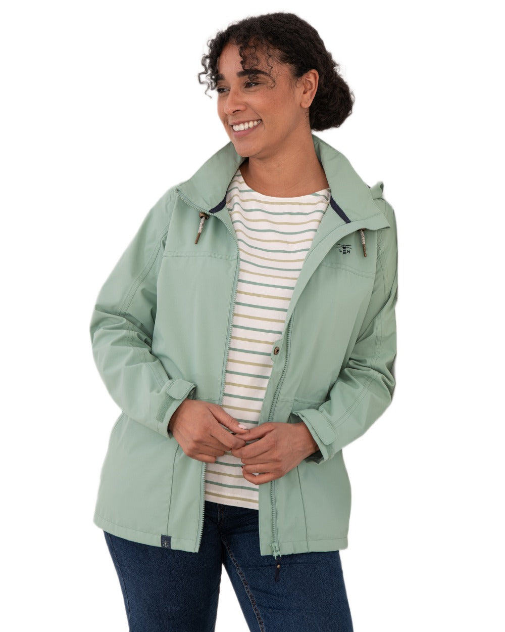 Basil coloured Lighthouse Ladies Beachcomber II Coat on white background 
