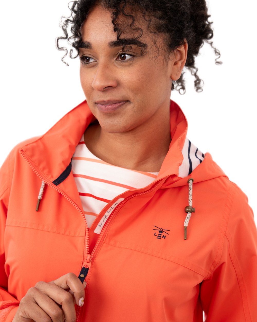 Coral coloured Lighthouse Ladies Beachcomber II Coat on white background 