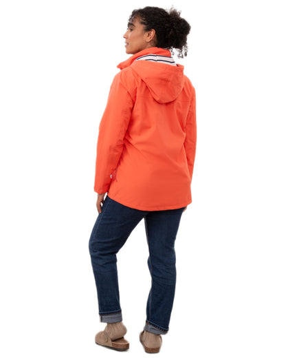 Coral coloured Lighthouse Ladies Beachcomber II Coat on white background 