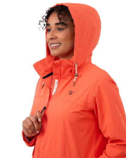 Coral coloured Lighthouse Ladies Beachcomber II Coat on white background 