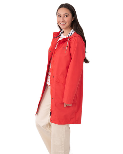 Poppy coloured Lighthouse Ladies Beachcomber Long Jacket II on white background 