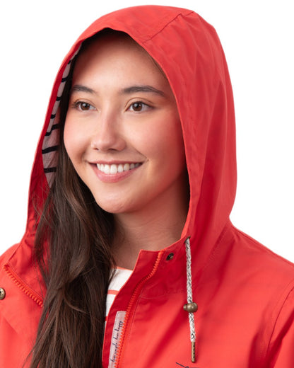 Poppy coloured Lighthouse Ladies Beachcomber Long Jacket II on white background 