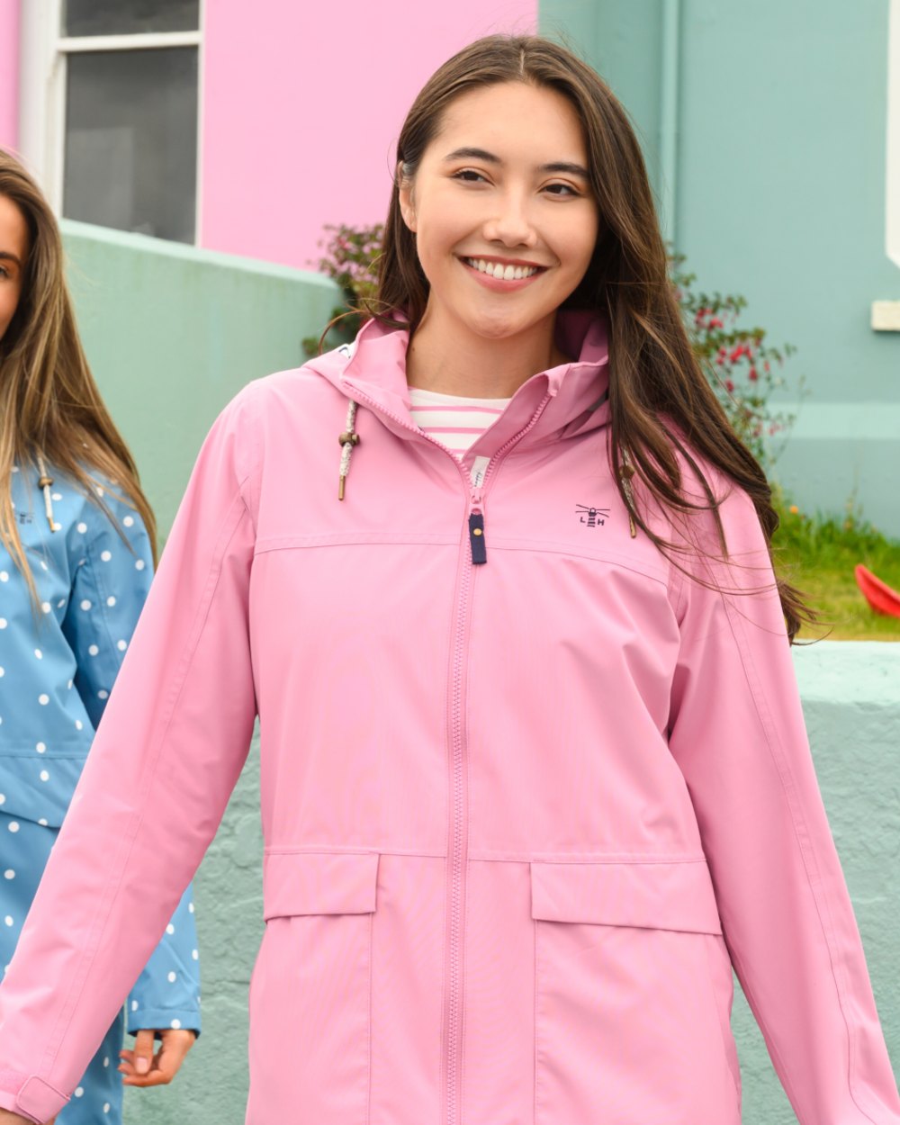Wild Rose coloured Lighthouse Ladies Beachcomber Long Jacket II on outdoor background 