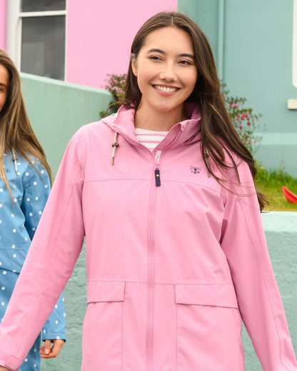 Wild Rose coloured Lighthouse Ladies Beachcomber Long Jacket II on outdoor background 