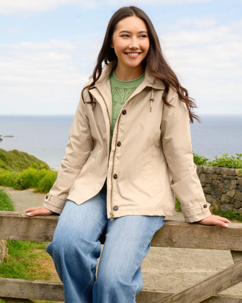 Clay coloured Lighthouse Ladies Blair Coat on outdoor background 