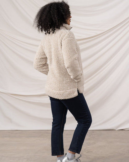 Irish Cream coloured Lighthouse Ladies Coast Half Zip Fleece Sweater on curtain background 