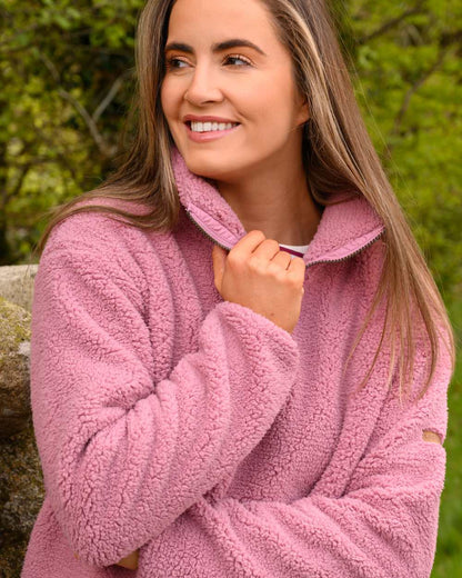 Wild Rose coloured Lighthouse Ladies Coast Half Zip Fleece Sweater on tree background 