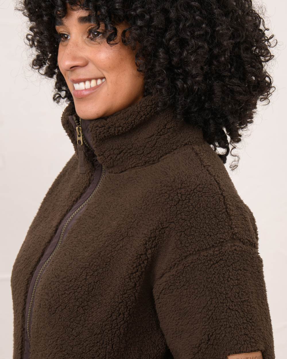 Cocoa coloured Lighthouse Ladies Cobh Full Zip Fleece Jacket on wall background 