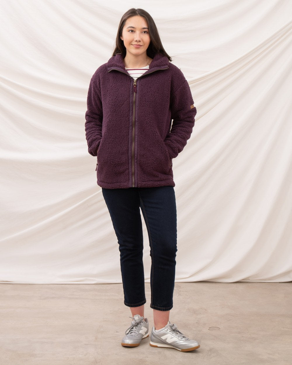 Cranberry coloured Lighthouse Ladies Cobh Full Zip Fleece Jacket on curtain background 