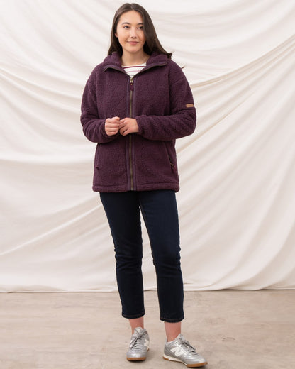 Cranberry coloured Lighthouse Ladies Cobh Full Zip Fleece Jacket on curtain background 