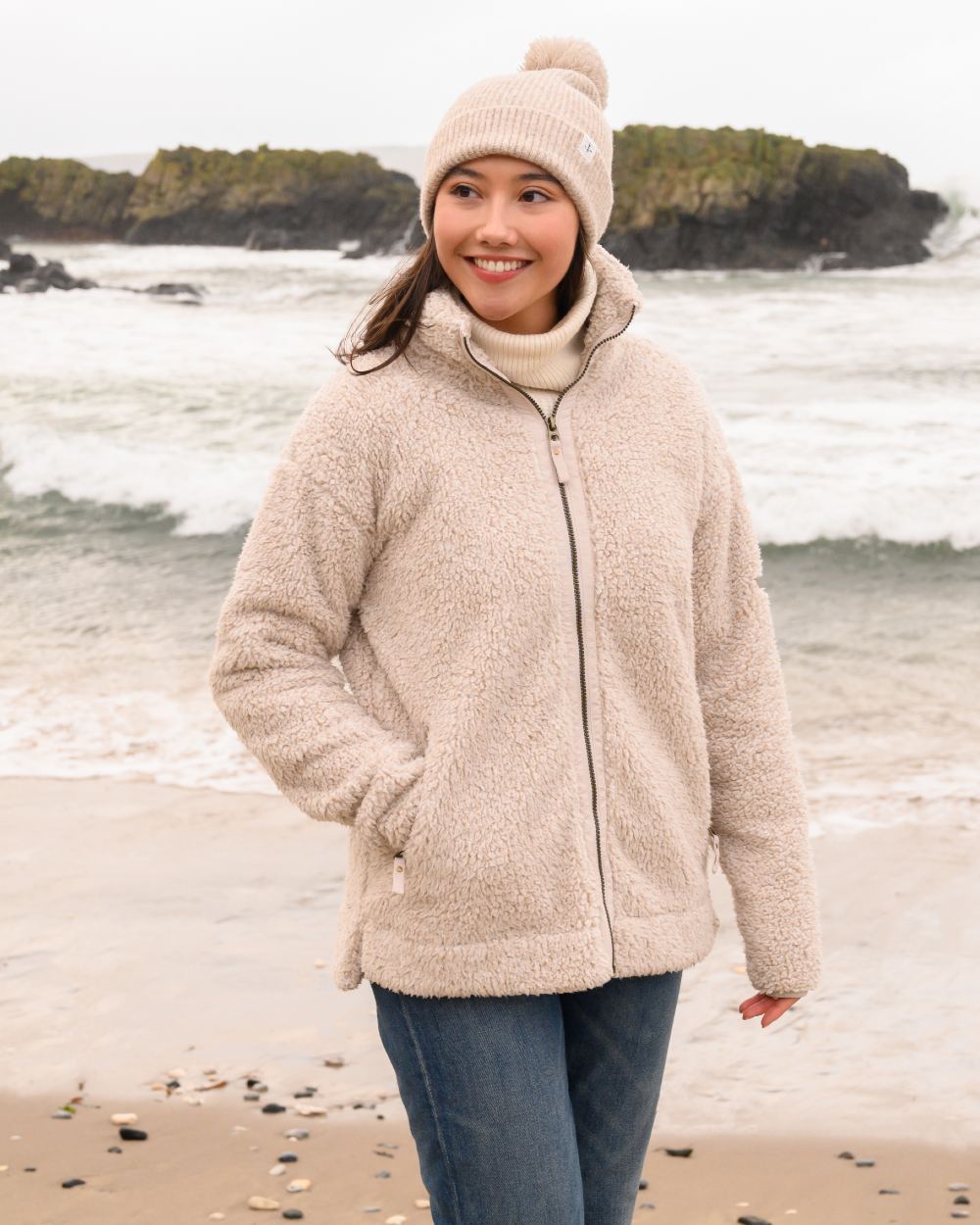 Irish Cream coloured Lighthouse Ladies Cobh Full Zip Fleece Jacket on sea background 