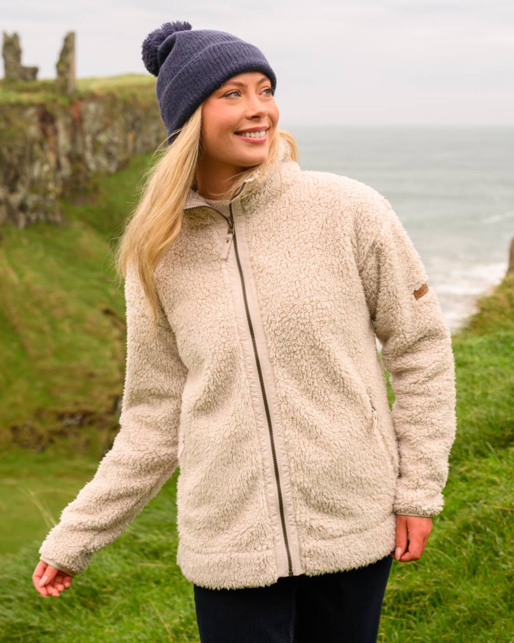 Irish Cream coloured Lighthouse Ladies Cobh Full Zip Fleece Jacket on sea background 