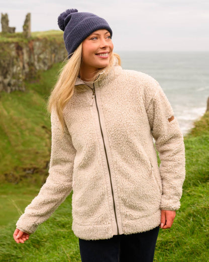 Irish Cream coloured Lighthouse Ladies Cobh Full Zip Fleece Jacket on sea background 