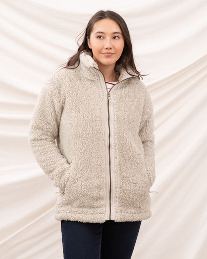 Irish Cream coloured Lighthouse Ladies Cobh Full Zip Fleece Jacket on curtain background 