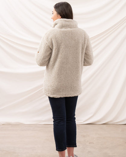 Irish Cream coloured Lighthouse Ladies Cobh Full Zip Fleece Jacket on curtain background 