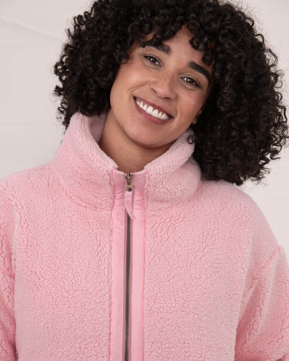 Pink coloured Lighthouse Ladies Cobh Full Zip Fleece Jacket on wall background 