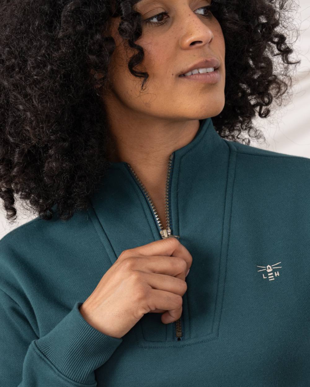 Pine coloured Lighthouse Ladies Coral Jersey on curtain background 