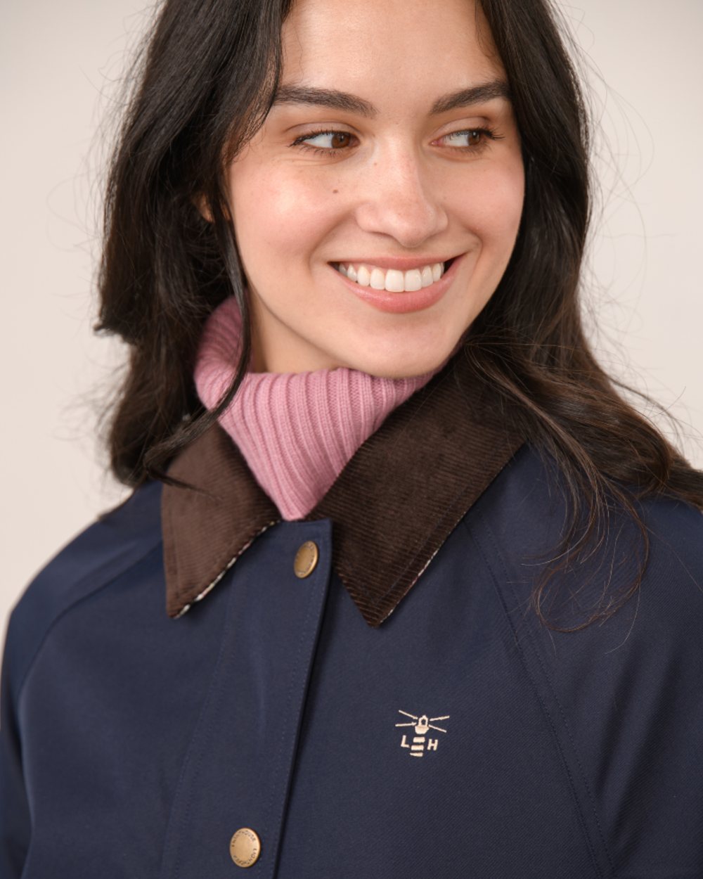 Navy coloured Lighthouse Ladies Devon Raincoat on indoor background 
