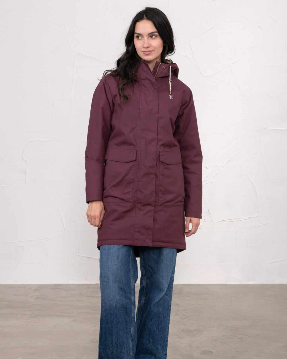 Damson coloured Lighthouse Ladies Fallon Coat on wall background 