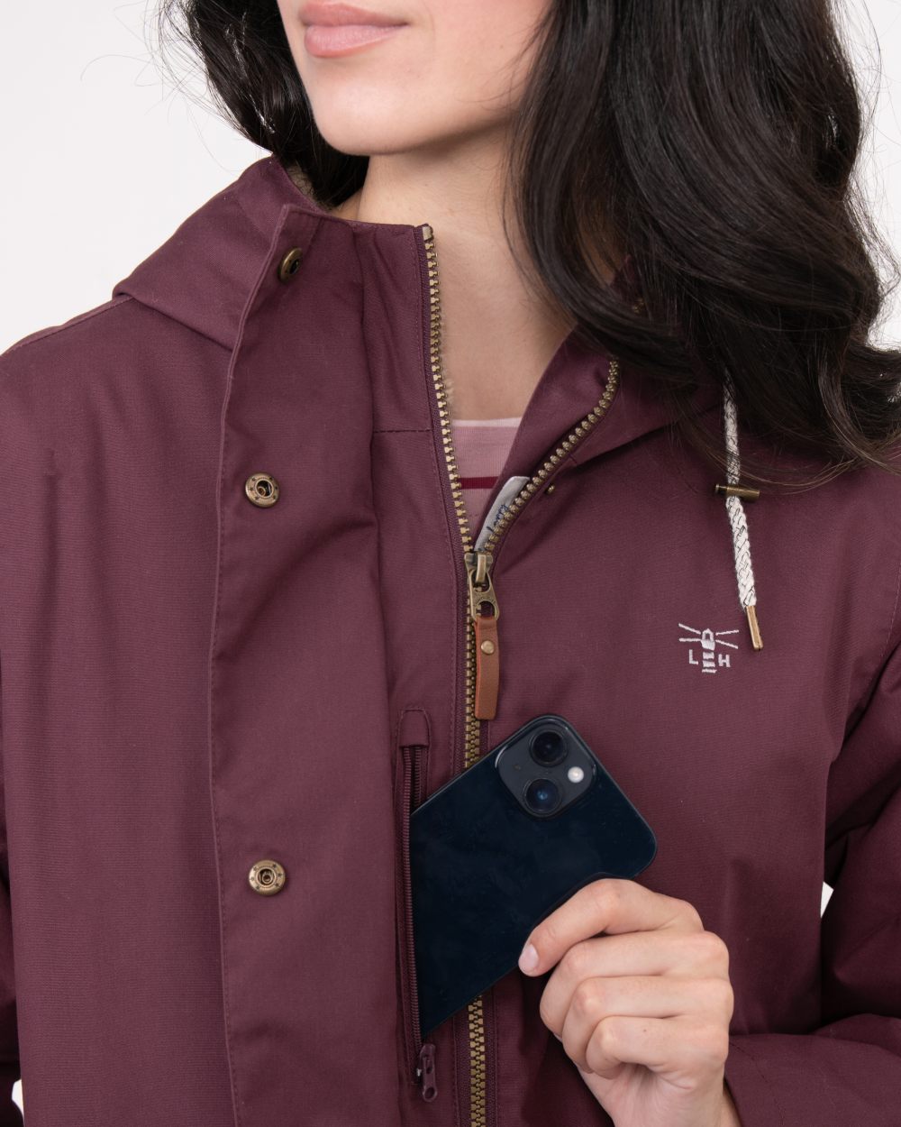 Damson coloured Lighthouse Ladies Fallon Coat on wall background 