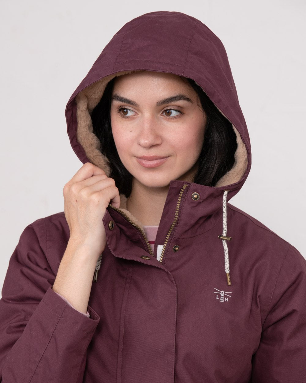 Damson coloured Lighthouse Ladies Fallon Coat on wall background 