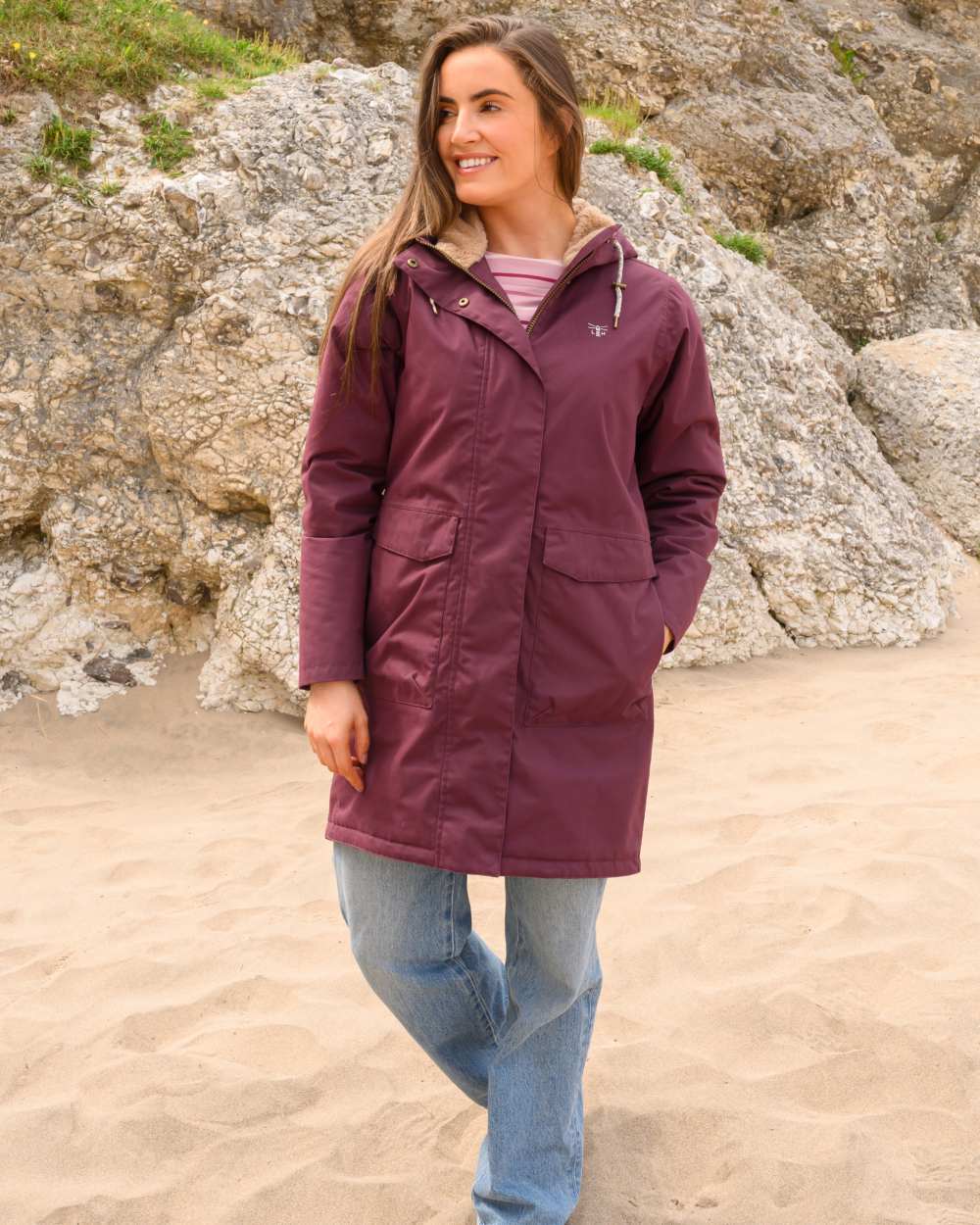 Damson coloured Lighthouse Ladies Fallon Coat on sand background 