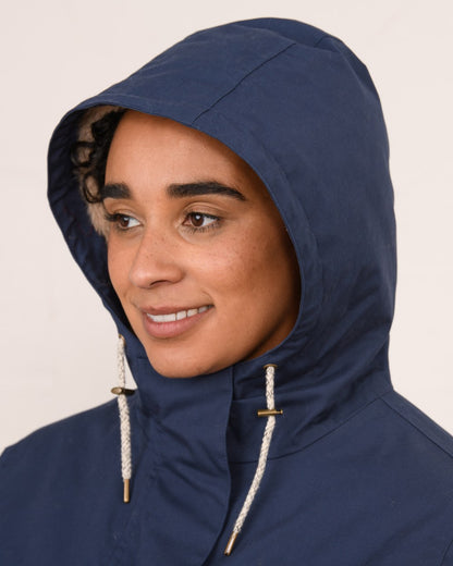 Navy coloured Lighthouse Ladies Fallon Coat on wall background 
