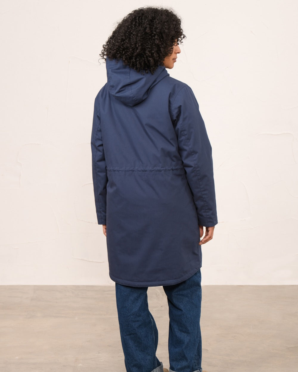 Navy coloured Lighthouse Ladies Fallon Coat on wall background 