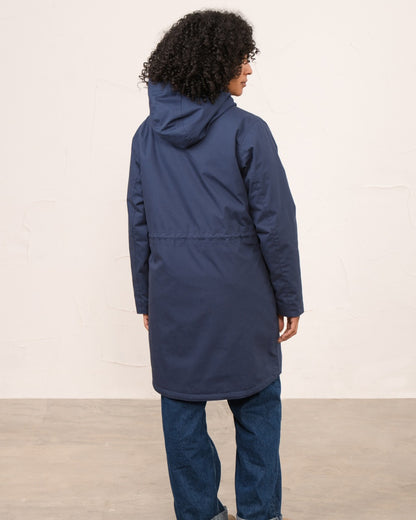 Navy coloured Lighthouse Ladies Fallon Coat on wall background 