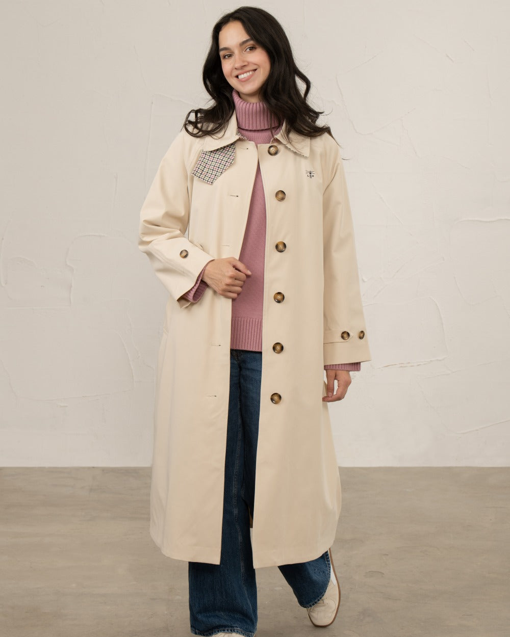 Stone coloured Lighthouse Ladies Harper Waterproof Trench Coat on wall background 