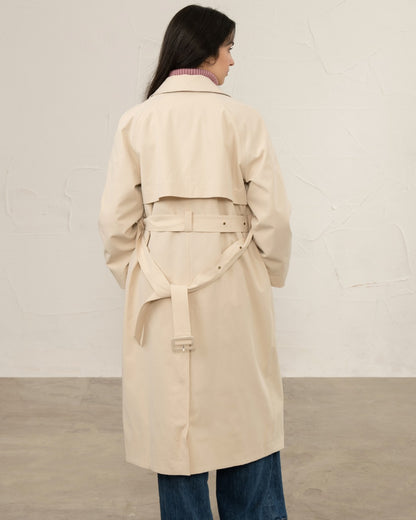 Stone coloured Lighthouse Ladies Harper Waterproof Trench Coat on wall background 